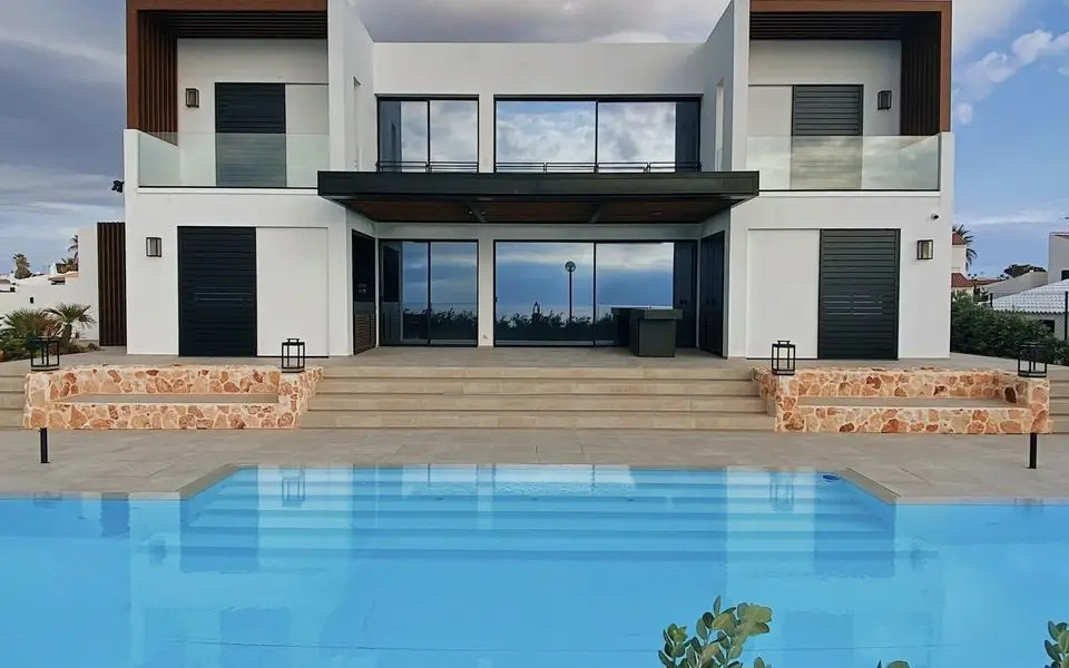 Modern villa facade with glass balustrades